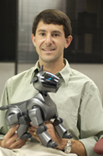 Dr. Peter H. Stone with a Sony Aibo soccer-playing robot