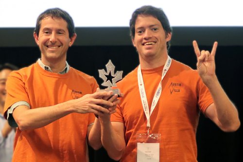 Peter Stone (left) and Patrick MacAlpine (right) accept the 1st place trophy for the 3D Simulation League at RoboCup 2018, held in Montreal, Canada.